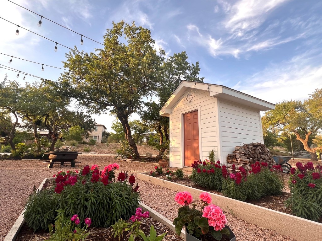 7197 Mt Sharp Road Wimberley, TX 78676 - Photo 32 of 39 a view of a flowers in front of a house