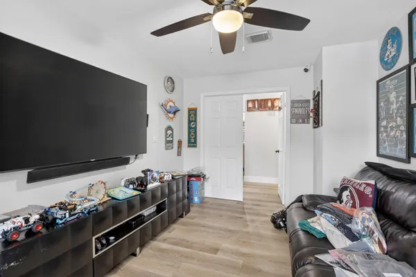 a room with furniture and flat screen tv