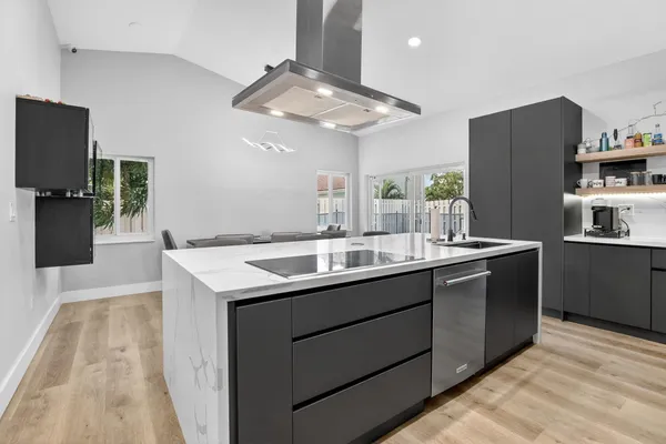a kitchen with a sink and refrigerator