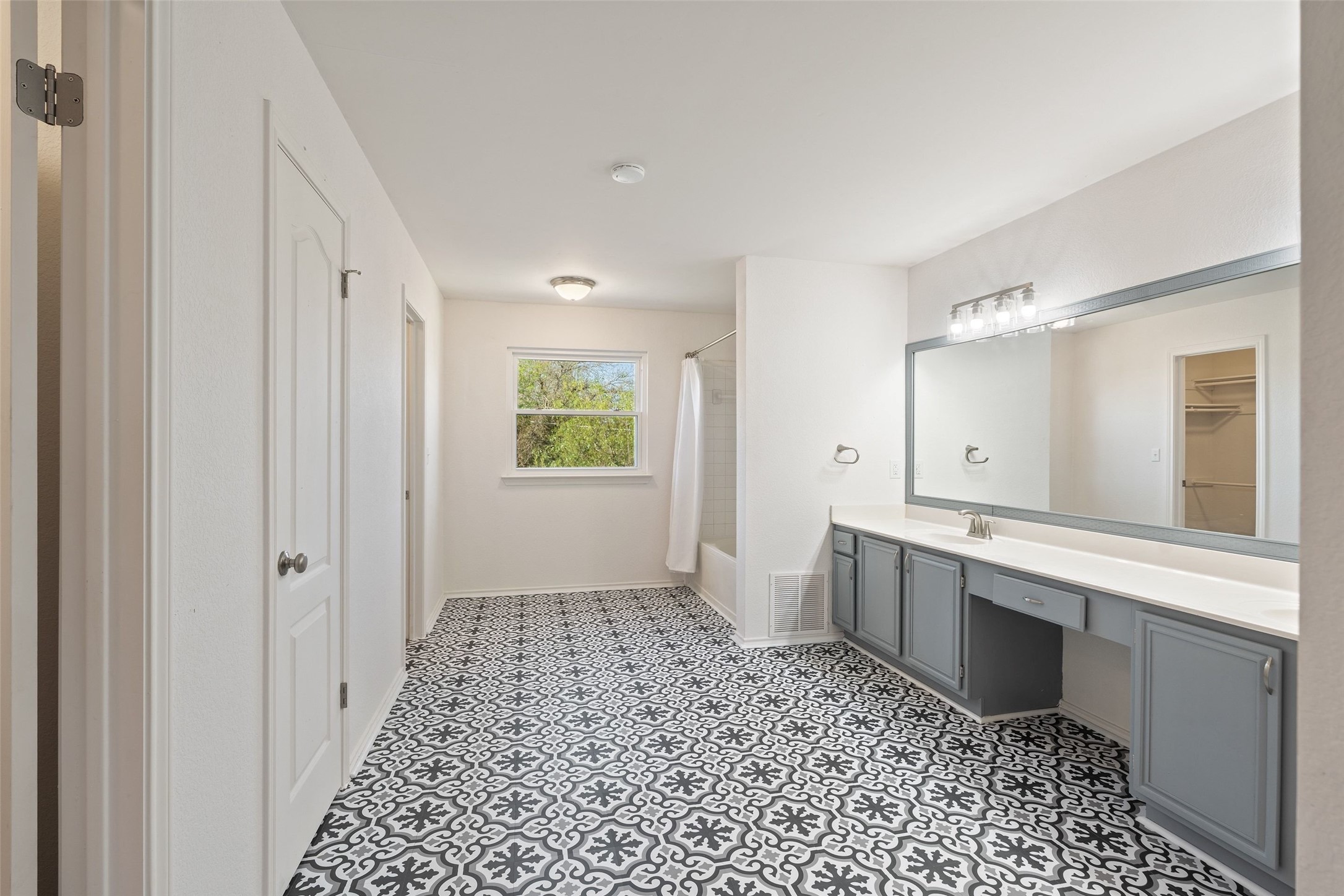 1011 Hayden Way Round Rock, TX 78664 - Photo 12 of 23 a bathroom with a sink a toilet and a mirror