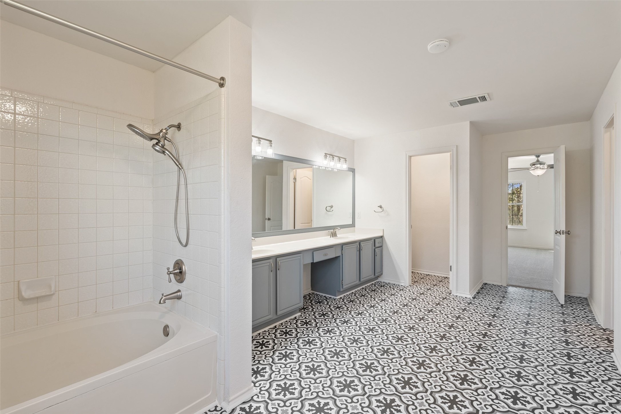 1011 Hayden Way Round Rock, TX 78664 - Photo 13 of 23 a bathroom with a bathtub sink and shower