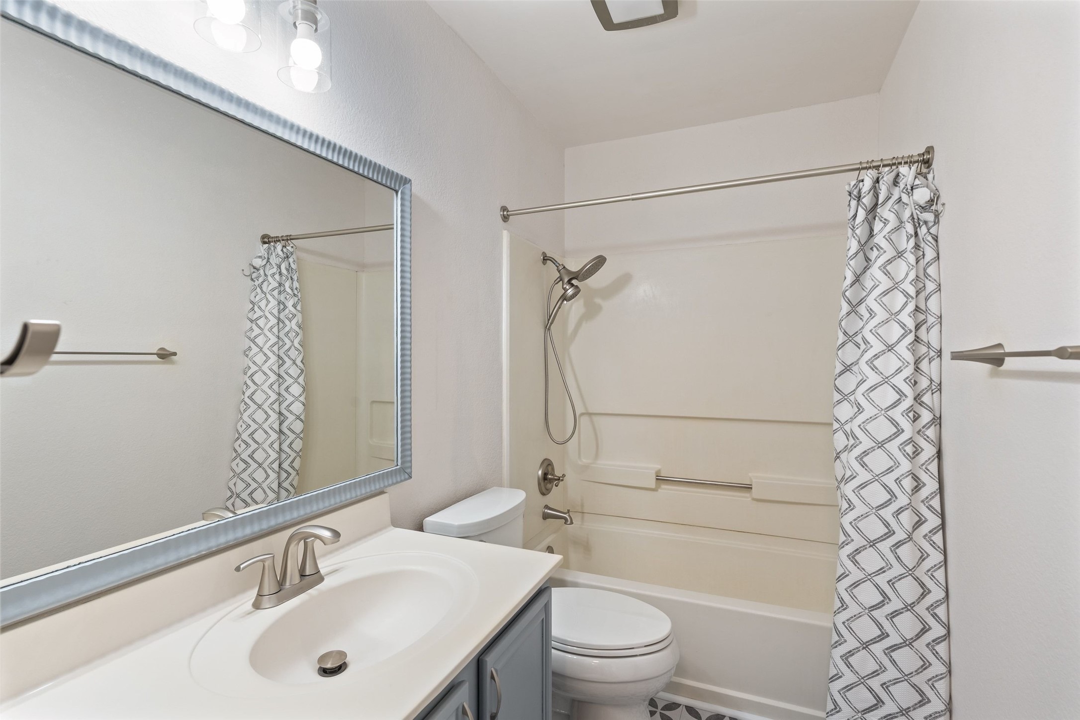 1011 Hayden Way Round Rock, TX 78664 - Photo 18 of 23 a bathroom with a sink a toilet and shower