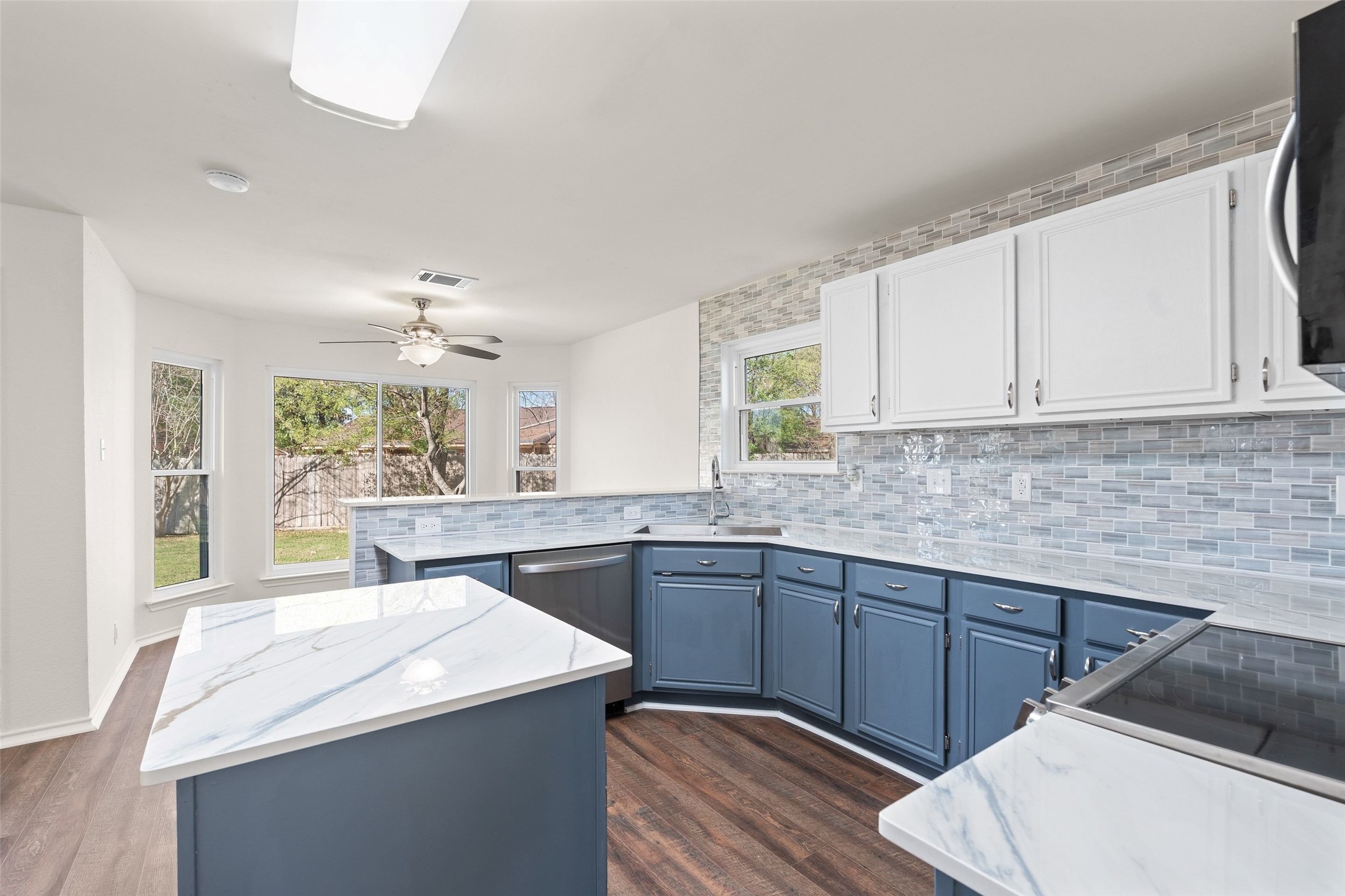1011 Hayden Way Round Rock, TX 78664 - Photo 8 of 23 a kitchen with a sink stove and cabinets