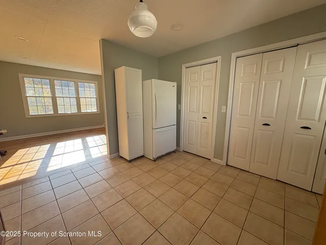 a kitchen with stainless steel appliances granite countertop a sink and a stove