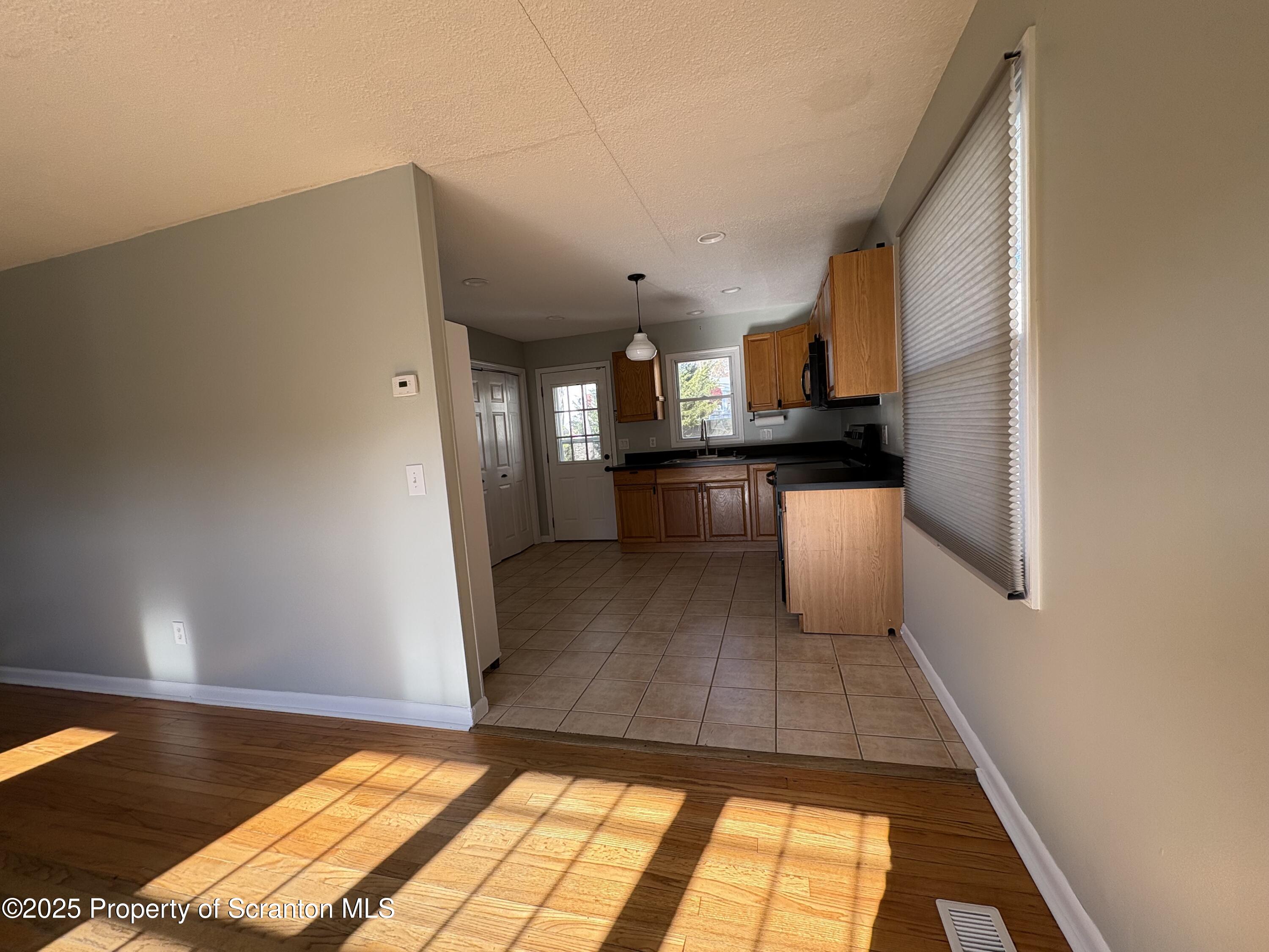 812 Old Winola Road Clarks Summit, PA 18411 - Photo 13 of 25 a kitchen with a sink cabinets and wooden floor