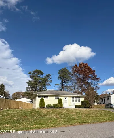 a view of houses with yard