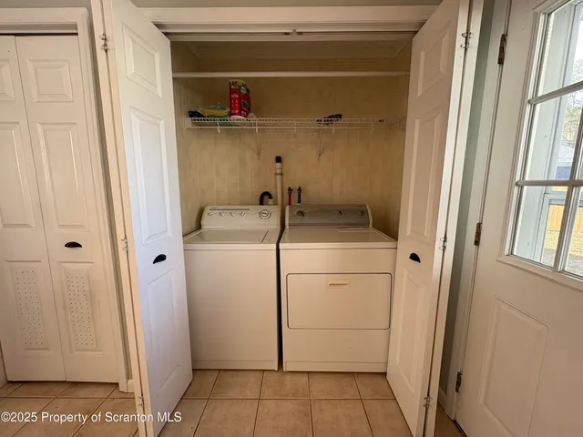 a bathroom with a sink and a washing machine