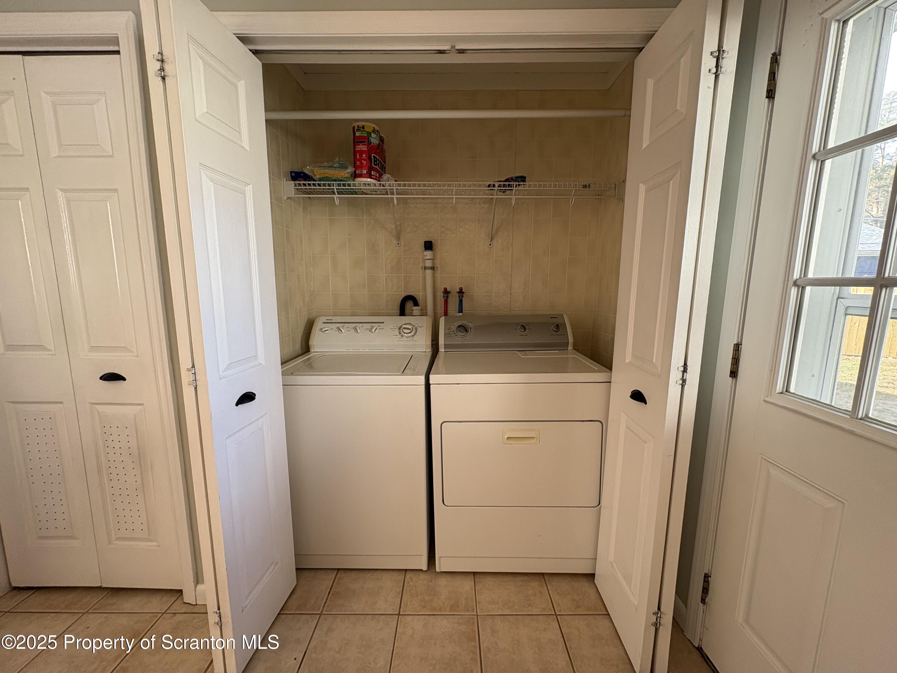 812 Old Winola Road Clarks Summit, PA 18411 - Photo 9 of 25 a bathroom with a sink and a washing machine
