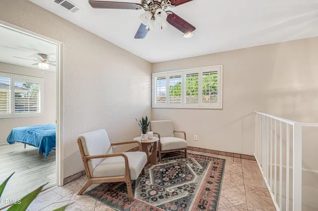 a living room with furniture and a rug