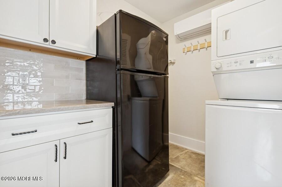 124 2nd Avenue Manasquan, NJ 08736 - Photo 13 of 38 a kitchen with a refrigerator and a stove