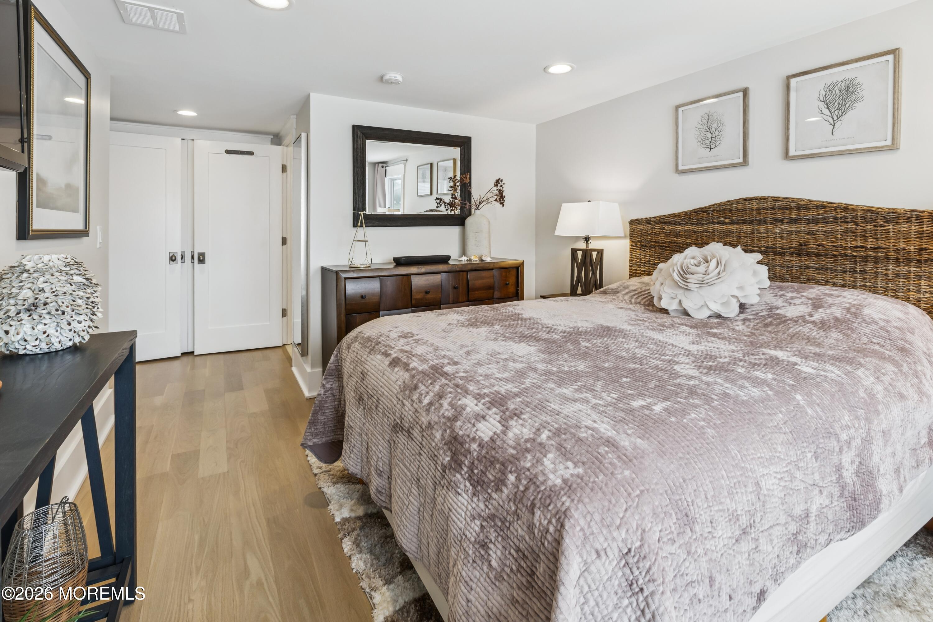 124 2nd Avenue Manasquan, NJ 08736 - Photo 18 of 38 a bedroom with a bed and a couch