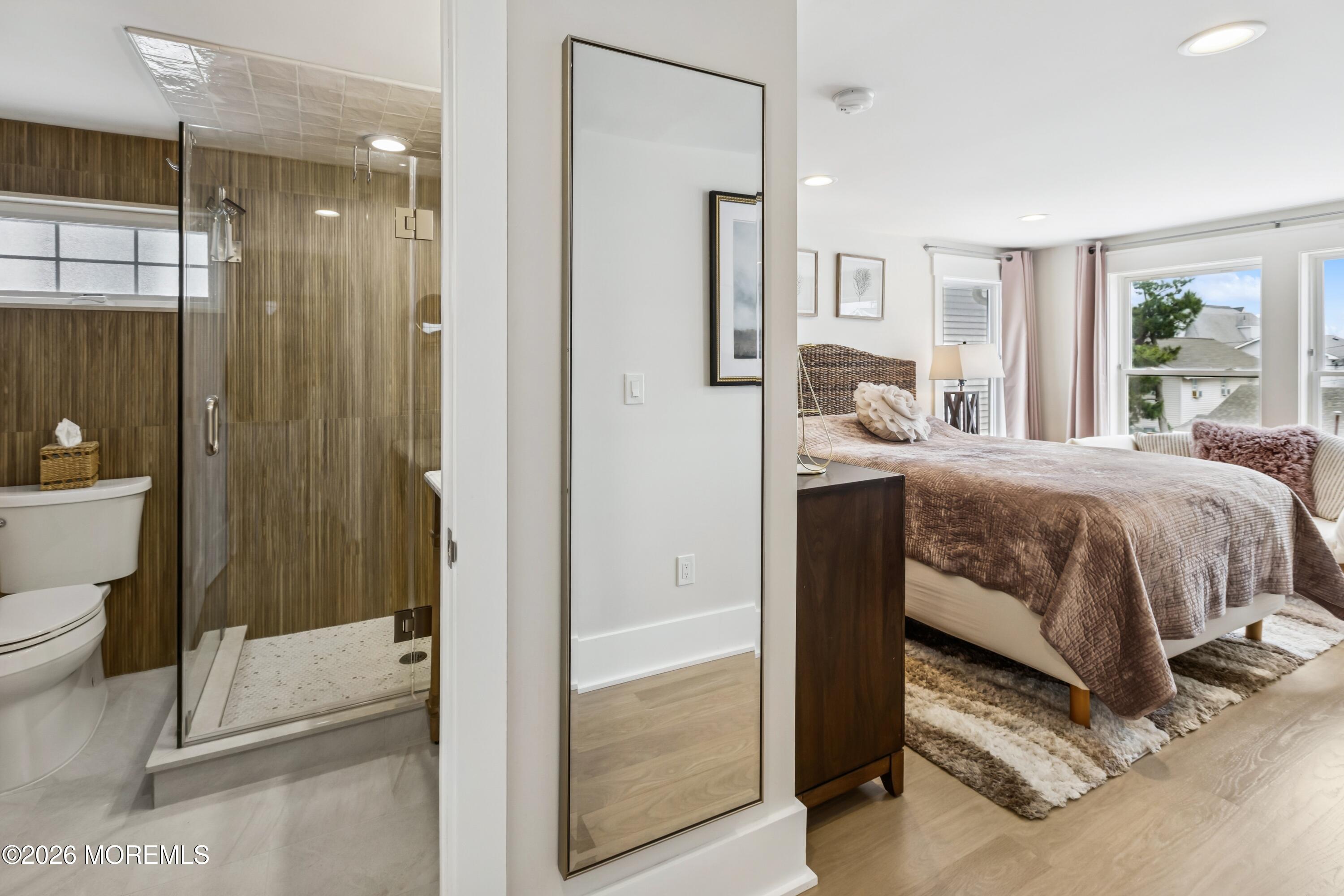 124 2nd Avenue Manasquan, NJ 08736 - Photo 20 of 38 a bedroom with a bed and a shower