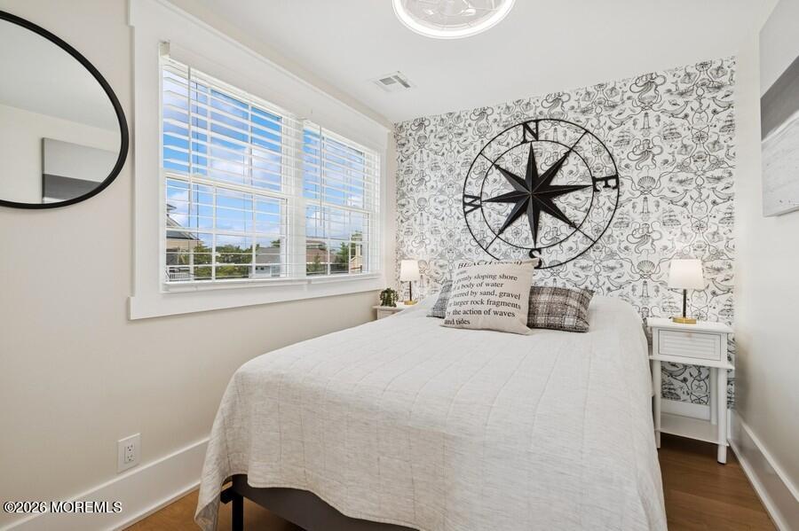124 2nd Avenue Manasquan, NJ 08736 - Photo 23 of 38 a bedroom with a bed and a window
