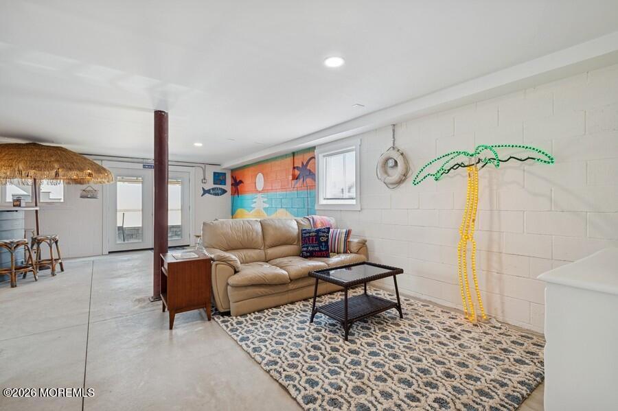 124 2nd Avenue Manasquan, NJ 08736 - Photo 28 of 38 a living room with furniture and a rug