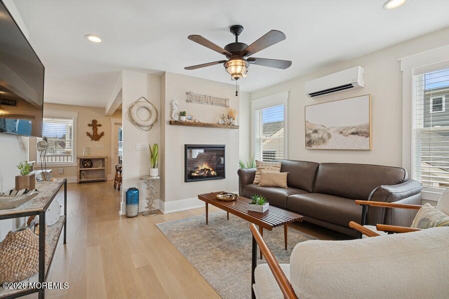 124 2nd Avenue Manasquan, NJ 08736 - Photo 3 of 38 a living room with furniture a clock and a fireplace