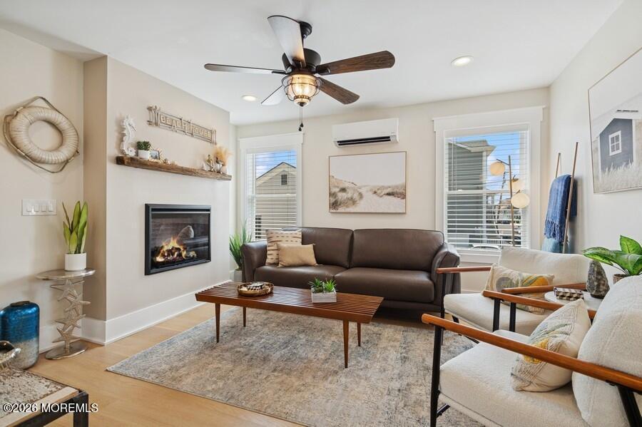 124 2nd Avenue Manasquan, NJ 08736 - Photo 4 of 38 a living room with furniture a fireplace and a window