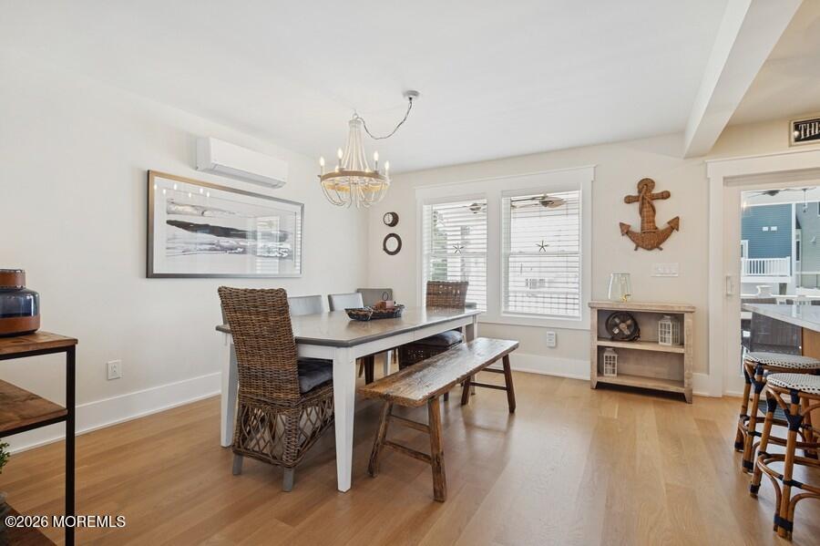 124 2nd Avenue Manasquan, NJ 08736 - Photo 9 of 38 a view of a dining room with furniture window and wooden floor