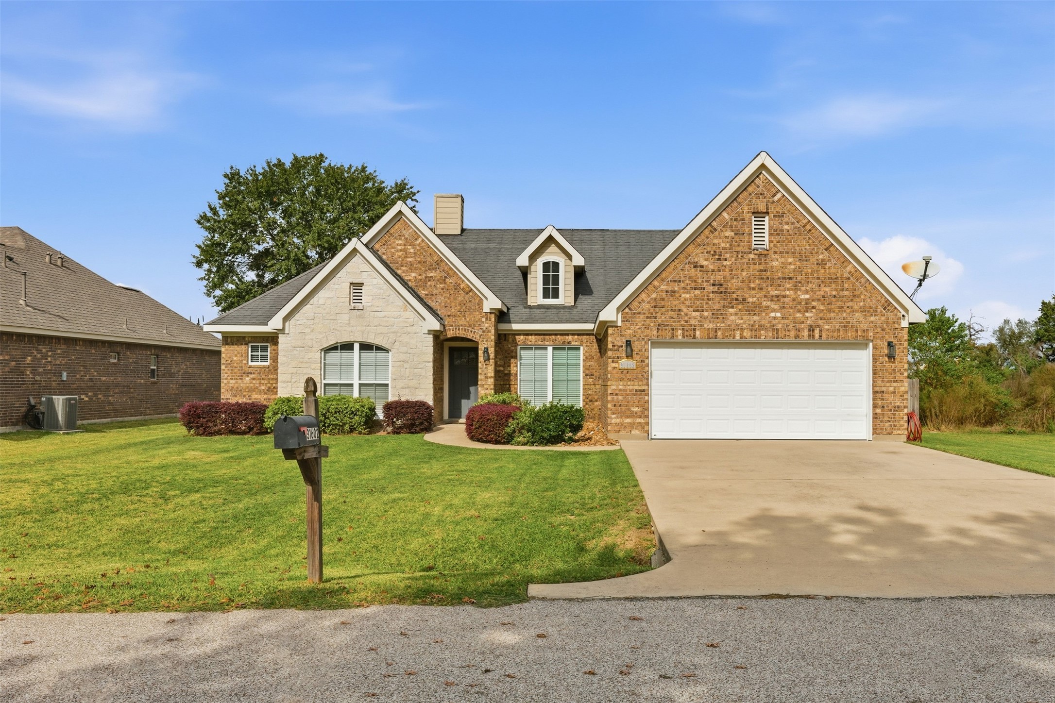 31602 Cypress Circle Waller, TX 77484 - Photo 1 of 32 a front view of a house with a yard and garage
