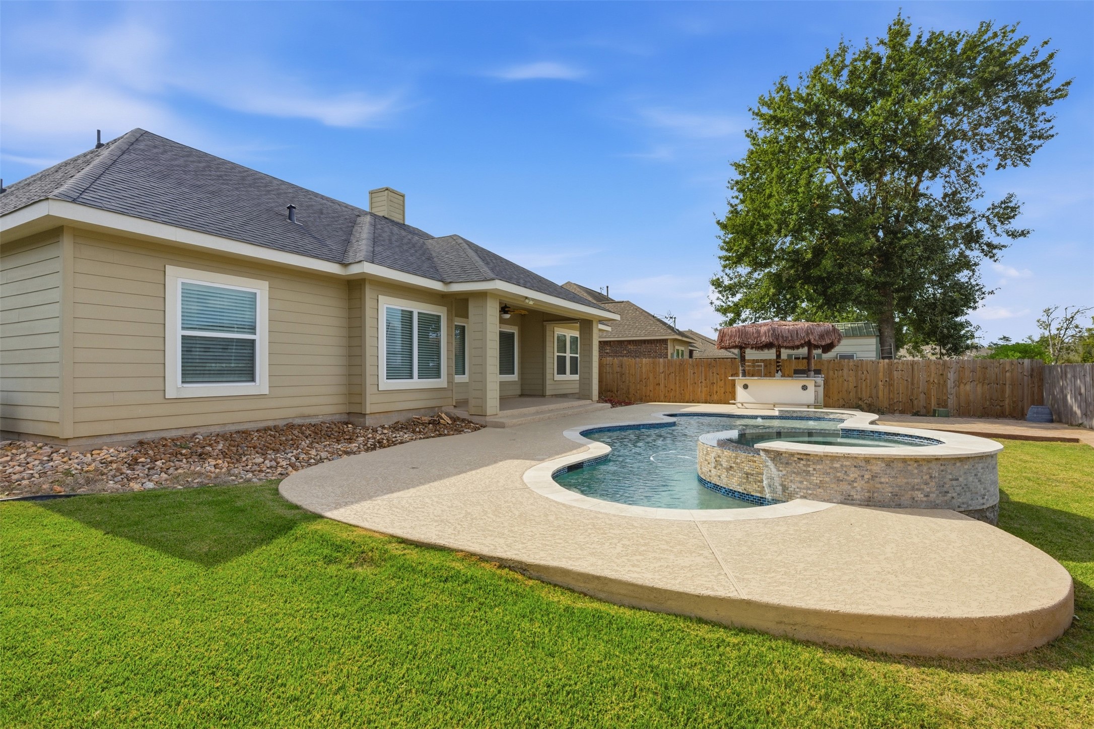 31602 Cypress Circle Waller, TX 77484 - Photo 30 of 32 a view of a backyard with table and chairs potted plants and tree