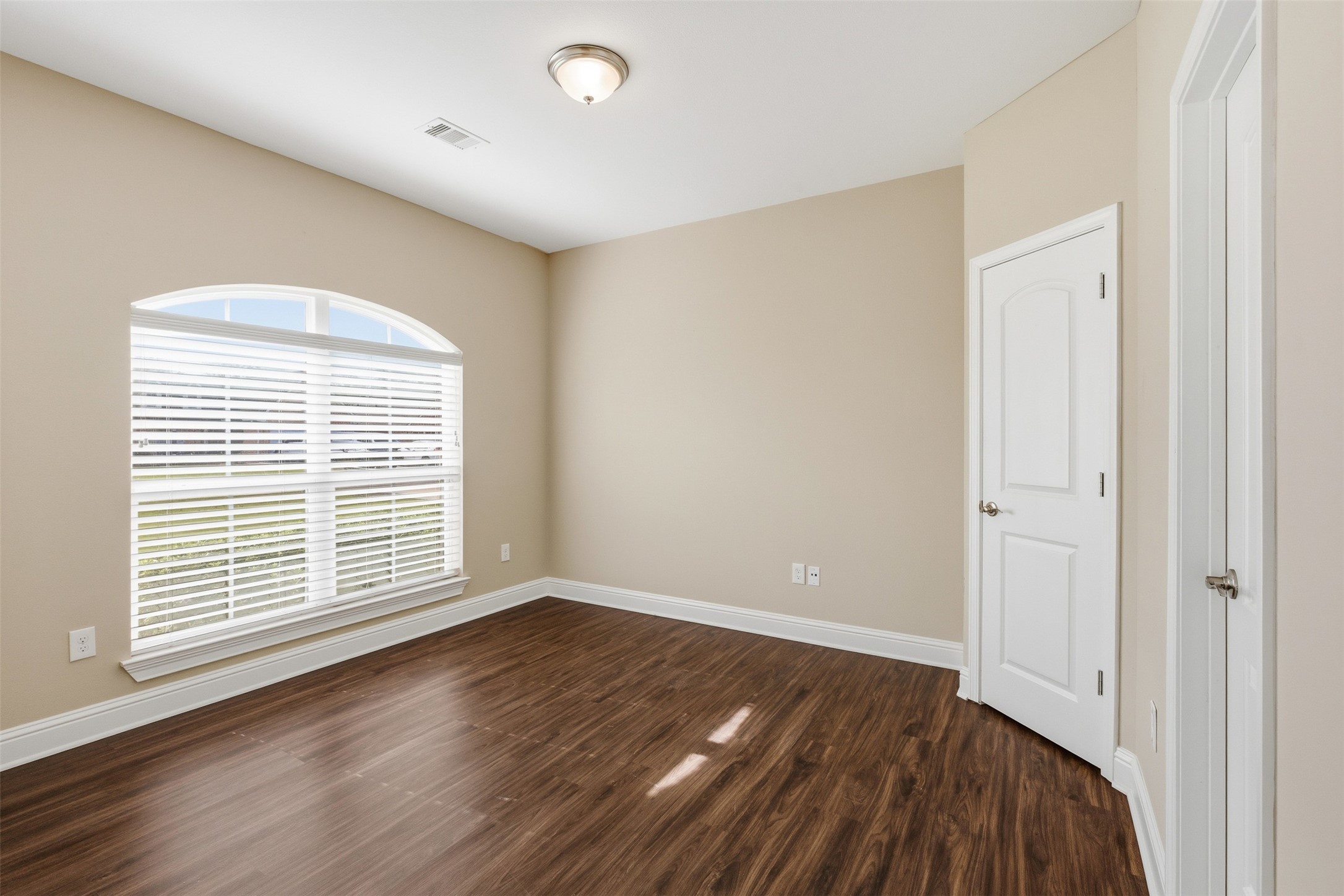 31602 Cypress Circle Waller, TX 77484 - Photo 6 of 32 a view of an empty room with wooden floor and a window