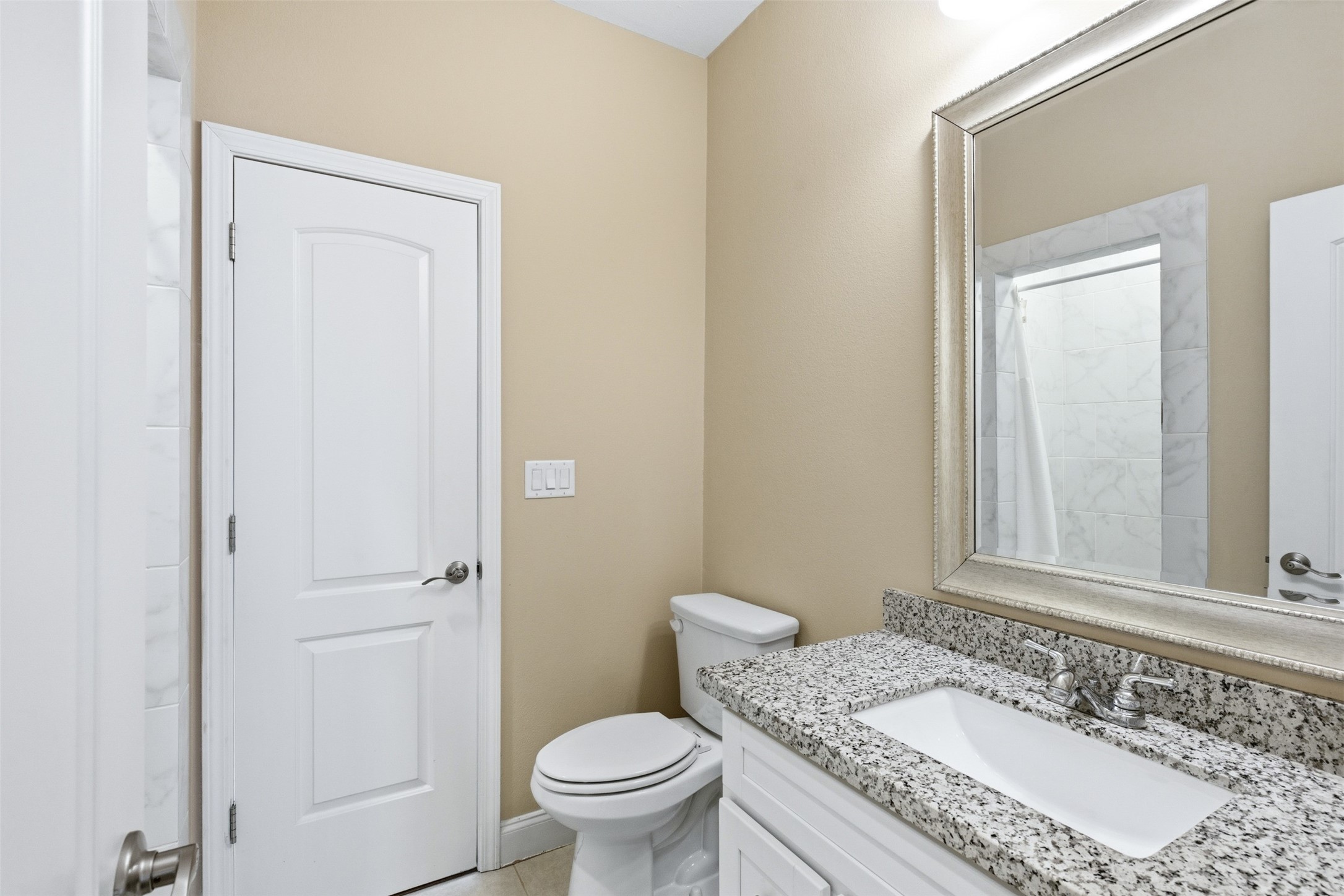 31602 Cypress Circle Waller, TX 77484 - Photo 8 of 32 a bathroom with a granite countertop sink toilet and shower