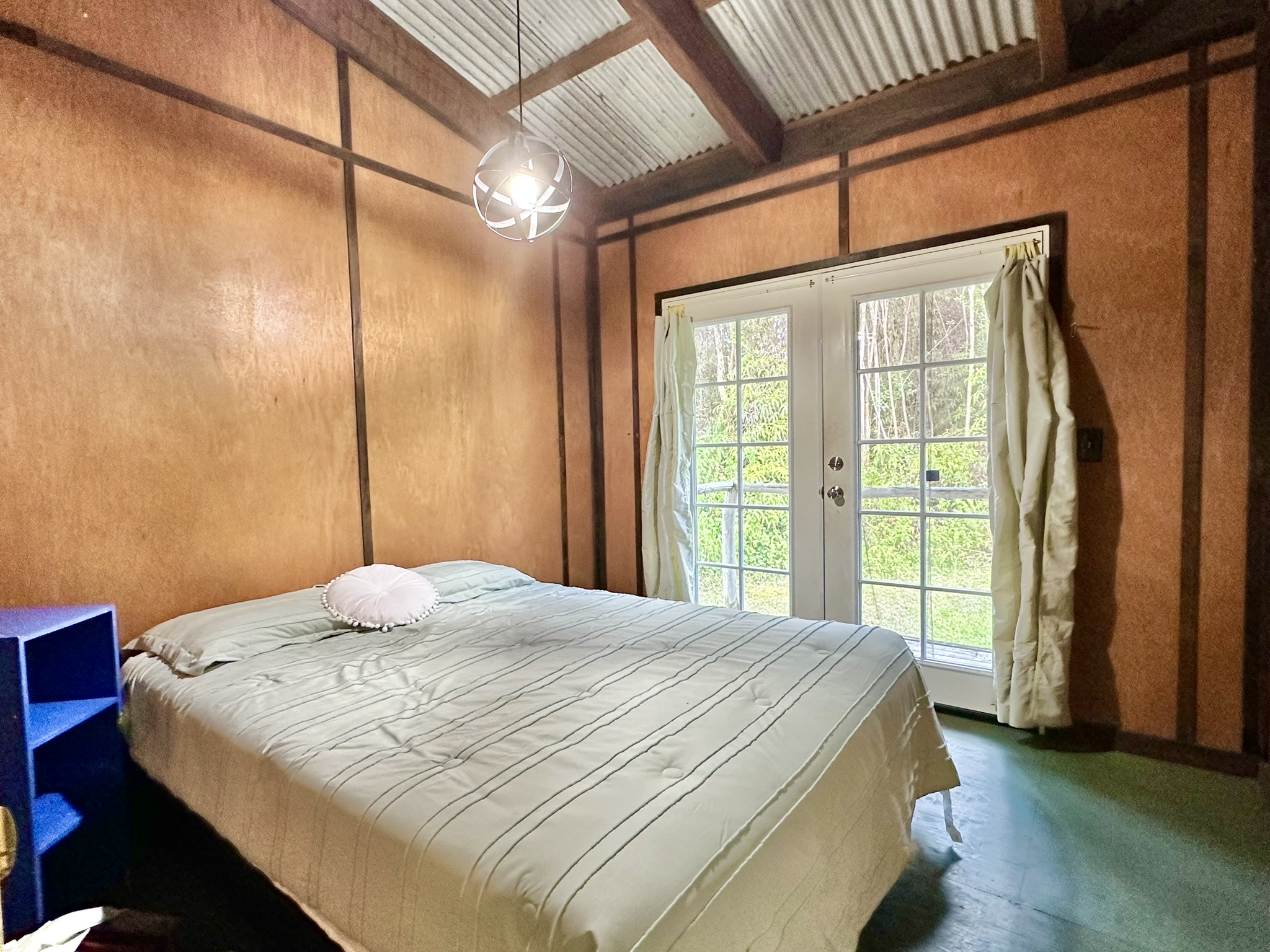 16-1581 Ao Rd Mountain View Mountain View, HI 96771 - Photo 8 of 21 a bedroom with a large bed and a window