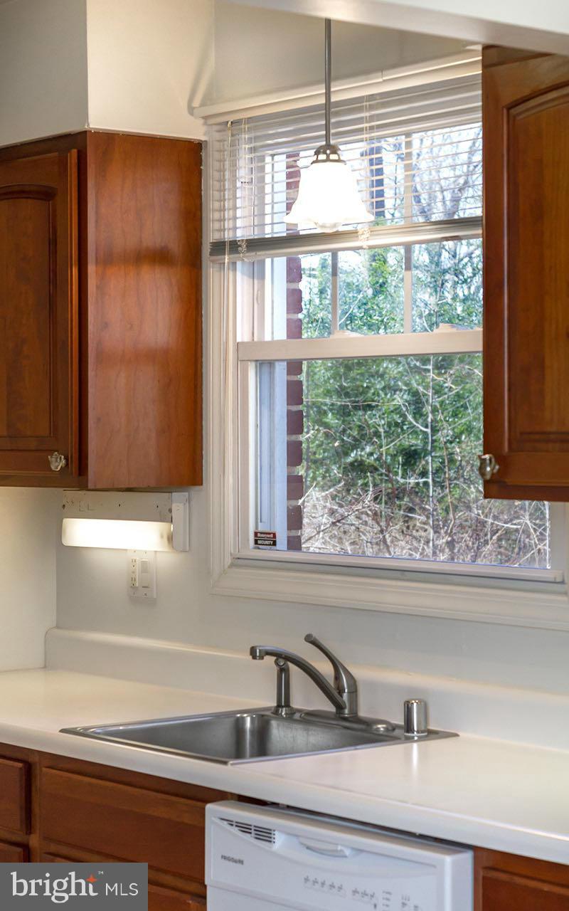 708 Sudbrook Road Pikesville, MD 21208 - Photo 17 of 30 a kitchen with a sink and a window