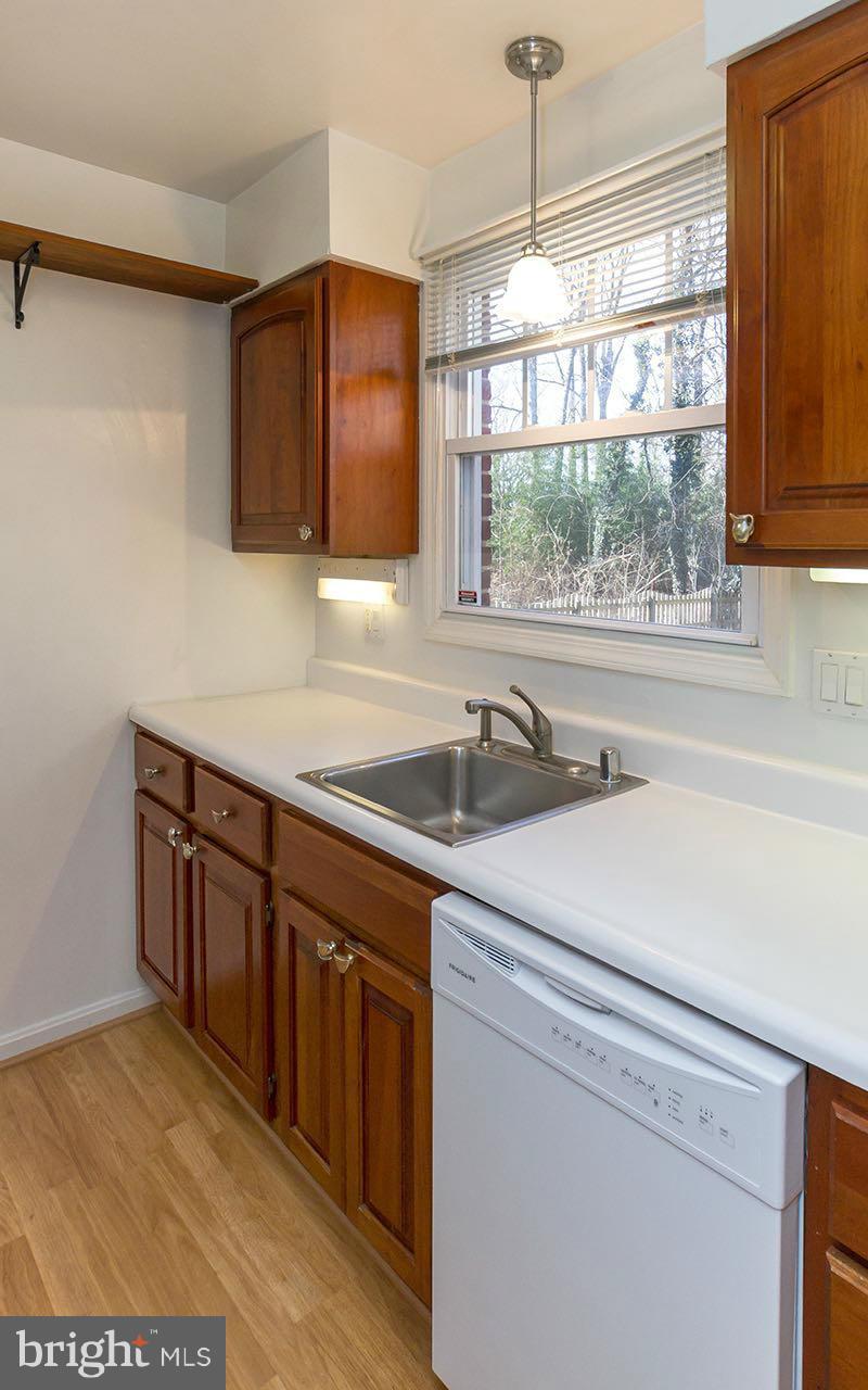 708 Sudbrook Road Pikesville, MD 21208 - Photo 18 of 30 a kitchen with stainless steel appliances granite countertop a sink and a window