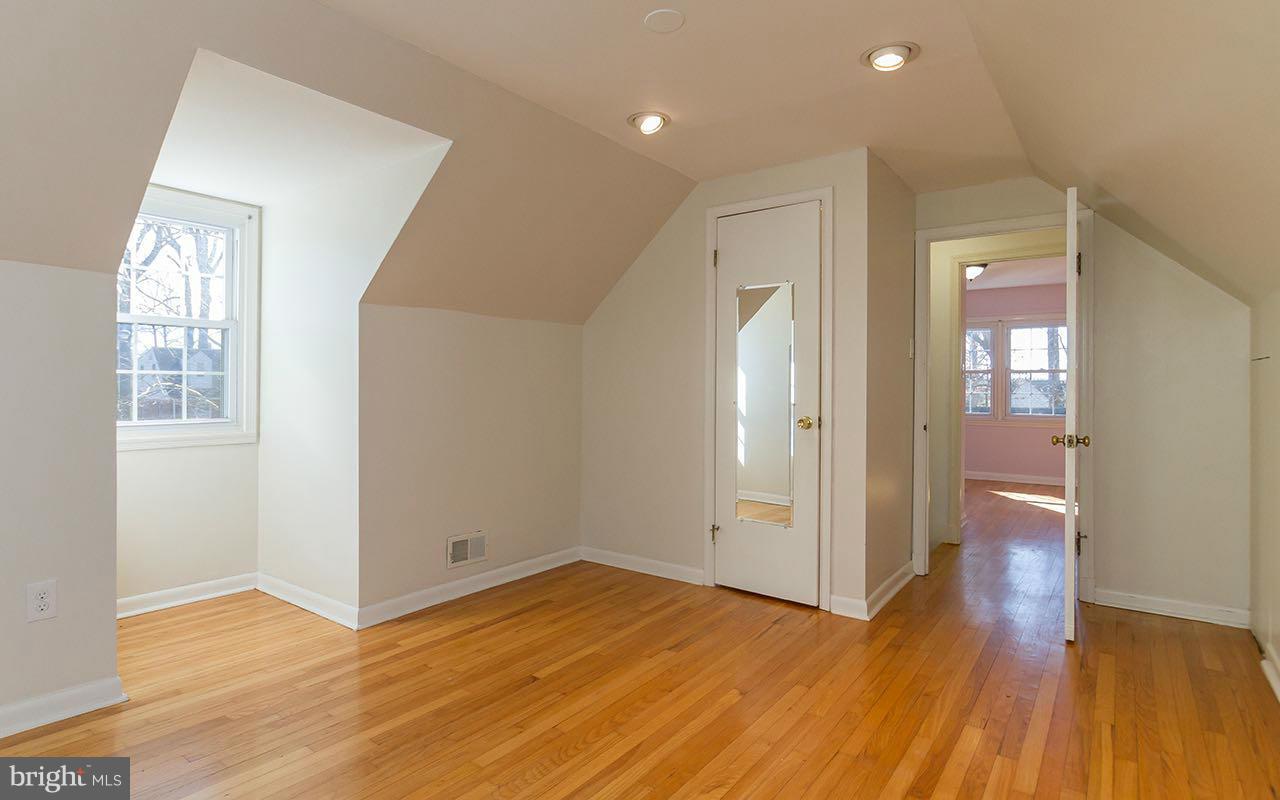 708 Sudbrook Road Pikesville, MD 21208 - Photo 25 of 30 wooden floor in an empty room with a window