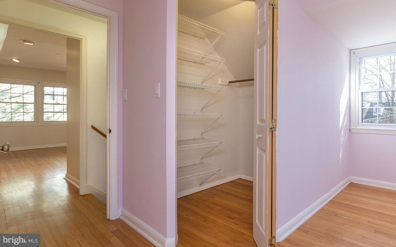 708 Sudbrook Road Pikesville, MD 21208 - Photo 9 of 30 wooden floor with a bedroom and windows