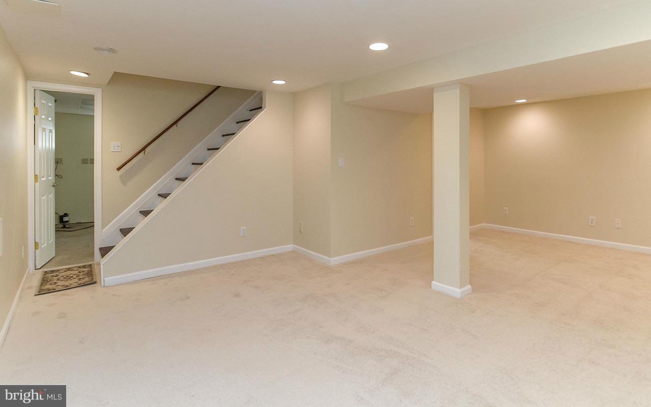 708 Sudbrook Road Pikesville, MD 21208 - Photo 10 of 30 a view of an empty room with stairs