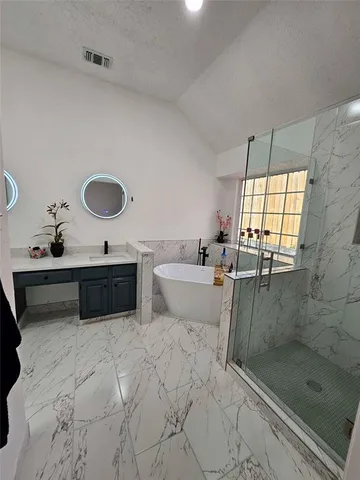 a bathroom with a sink double vanity and a mirror