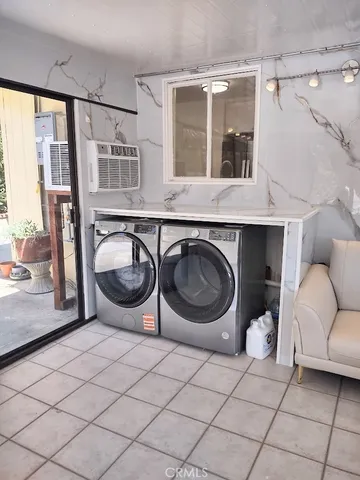 a view of a livingroom with furniture and windows