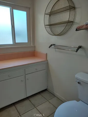a bathroom with a sink a mirror and a toilet