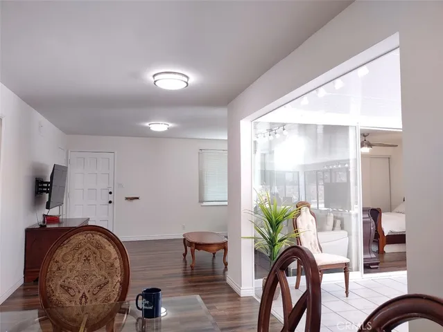 a view of a livingroom with furniture and a potted plant