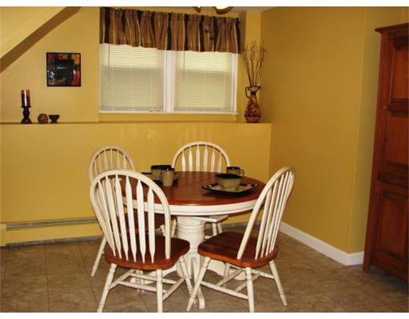 35 Cedar Street, Unit 2 Gardner, MA 01440 - Photo 4 of 9 a view of a dining room with furniture and wooden floor