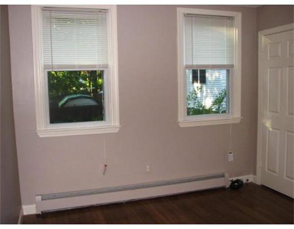 35 Cedar Street, Unit 2 Gardner, MA 01440 - Photo 8 of 9 an empty room with a window