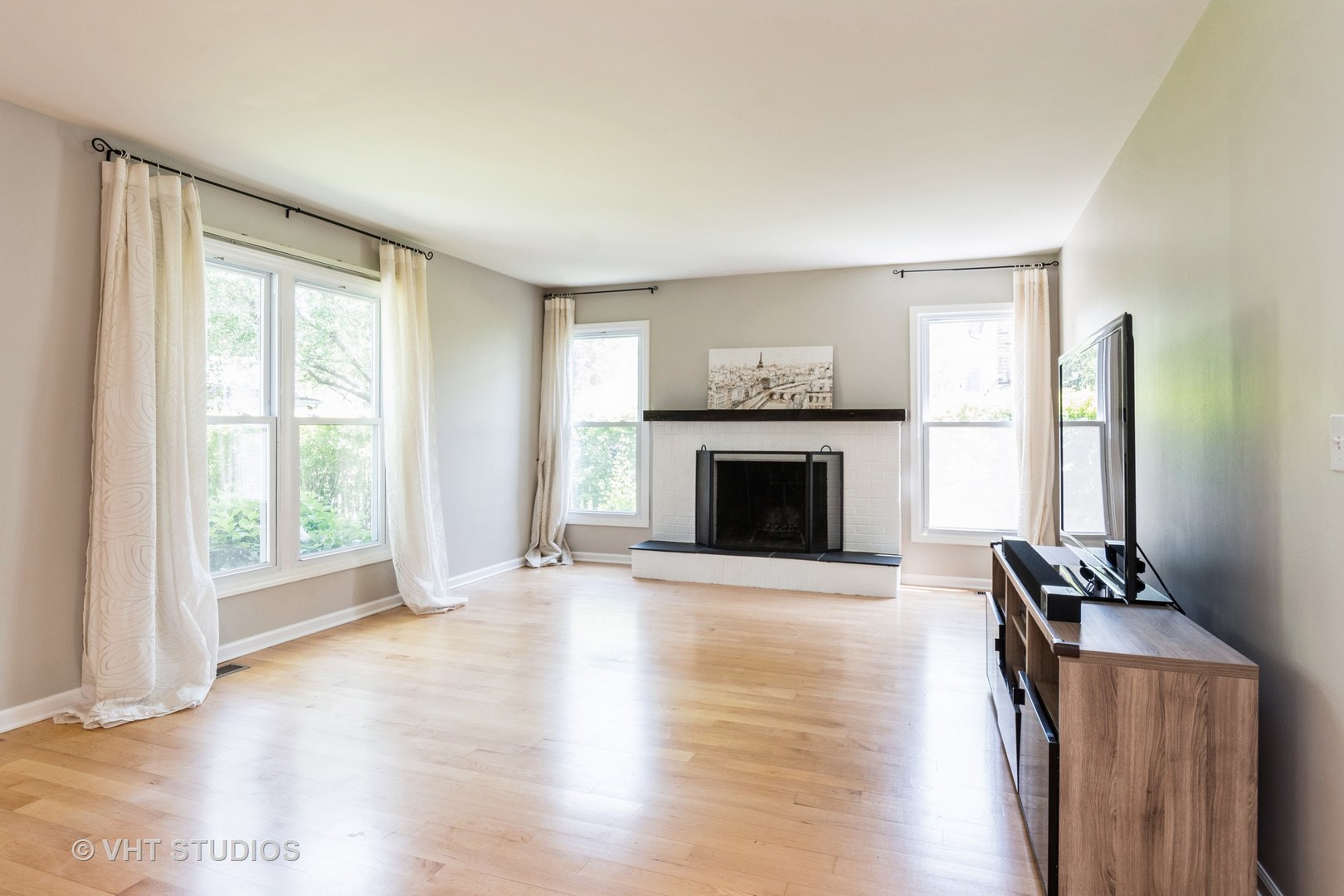 2272 Pontiac Circle Naperville, IL 60565 - Photo 3 of 14 a view of an empty room with wooden floor and a window