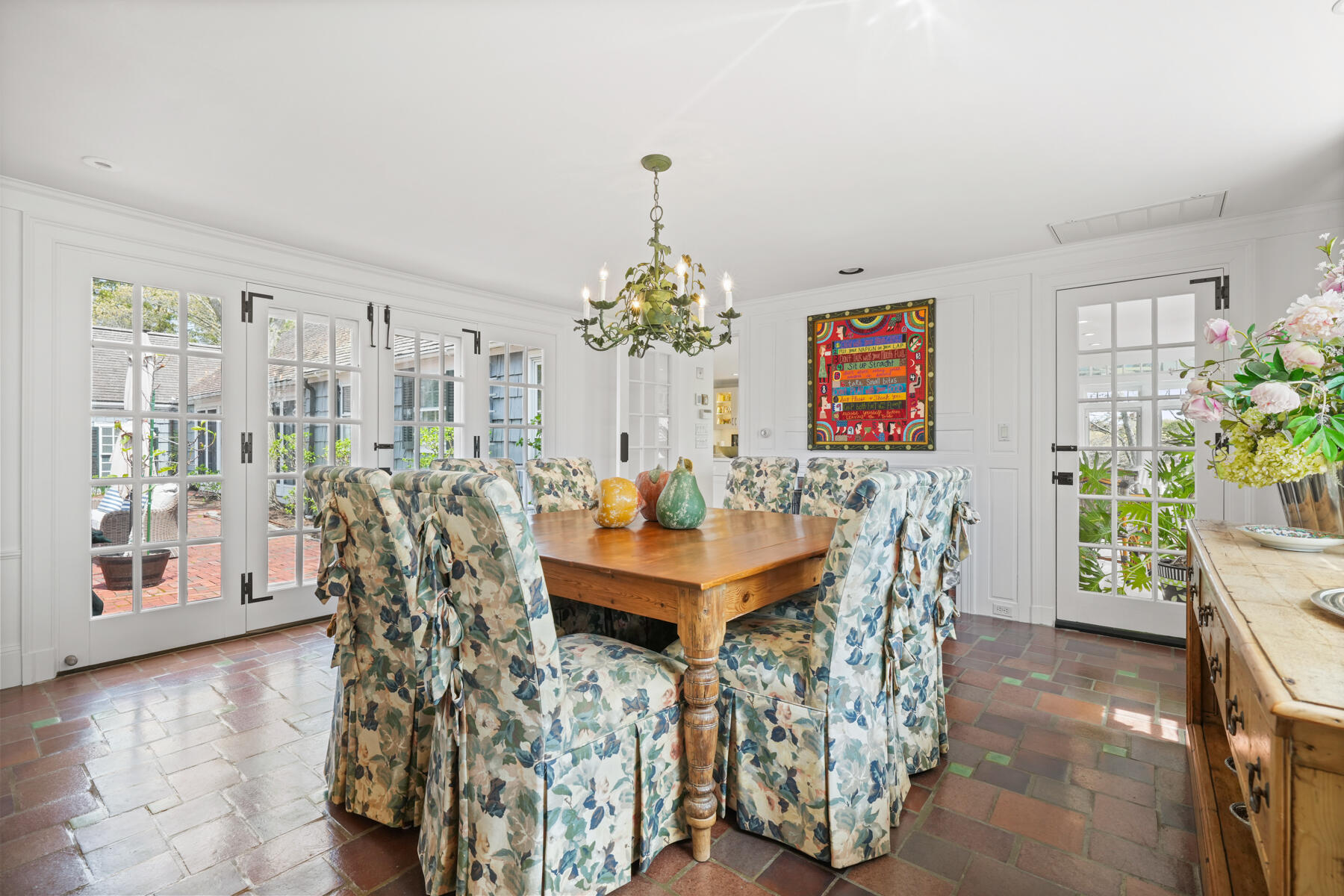68 Waterman Farm Road Centerville, MA 02632 - Photo 21 of 47 a view of a dining room with furniture and chandelier