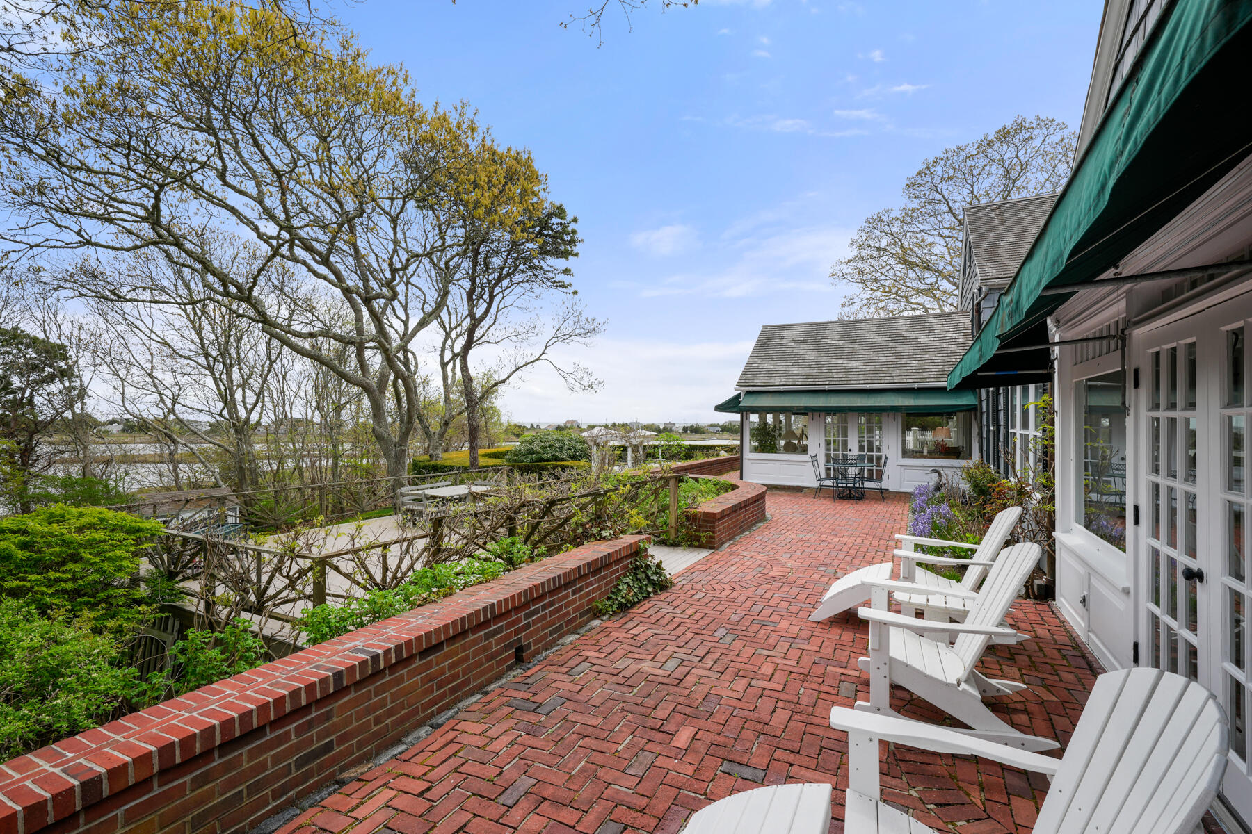 68 Waterman Farm Road Centerville, MA 02632 - Photo 10 of 47 a view of a patio with chairs next to a yard