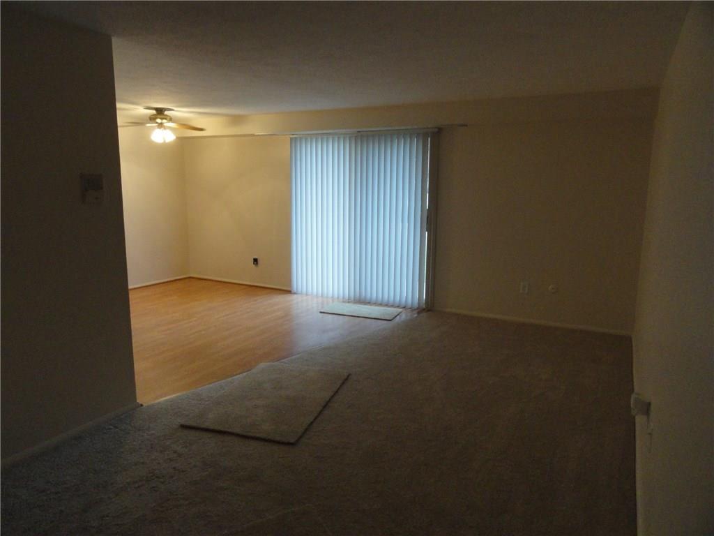 2455 Brook Ledge Road, Unit 24B Bridgeville, PA 15017 - Photo 3 of 25 Living room / dining room area- new flooring and fresh paint. New vertical blinds at sliding door to deck