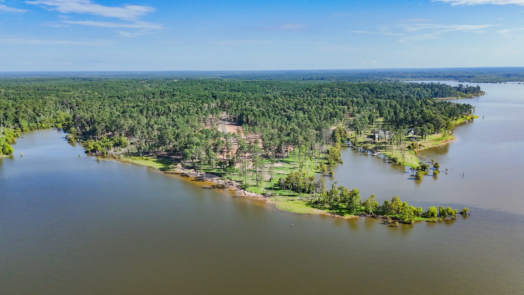 253 Debbie Lane Bronson, TX 75930 - Photo 2 of 17 a view of a lake with houses