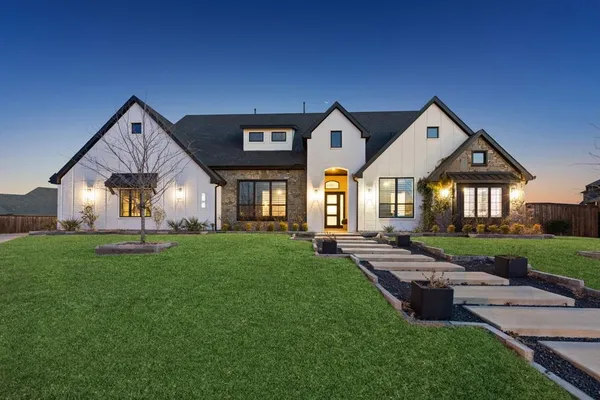 front view of a house with a yard