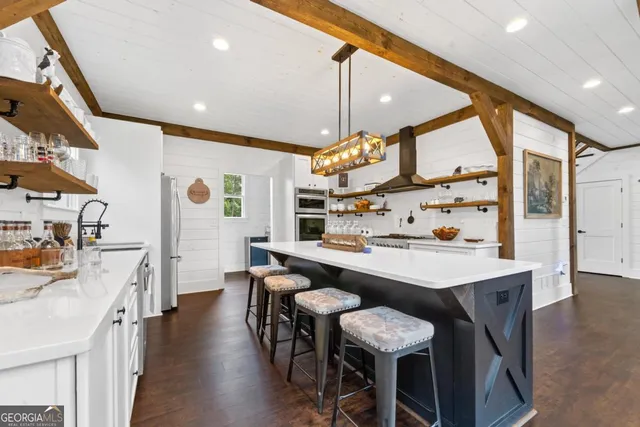a view of a kitchen cabinets and wooden floor
