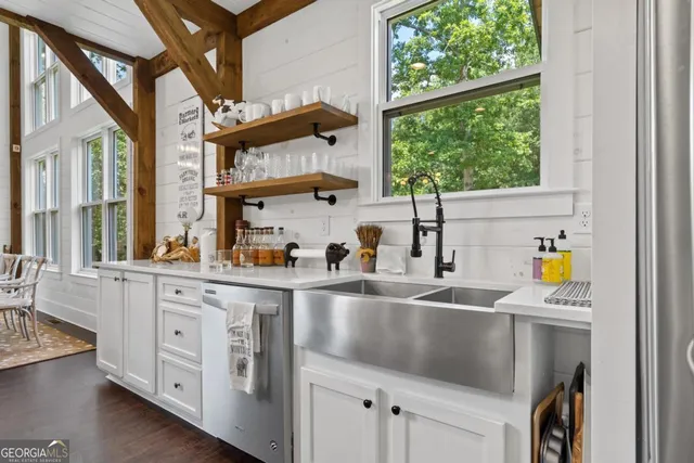 a view of an entryway with wooden floor