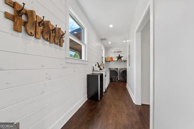 a bathroom with a glass door shower and a sink