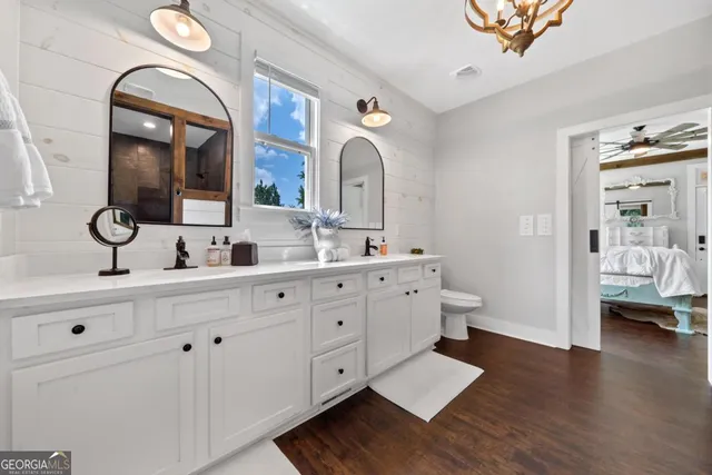 a bedroom with bed and window