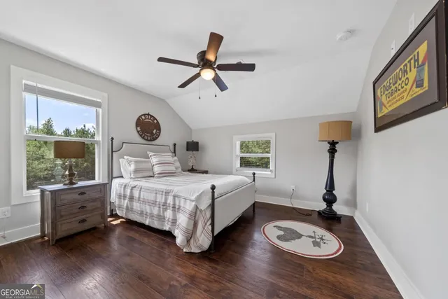 a bedroom with a bed and a table