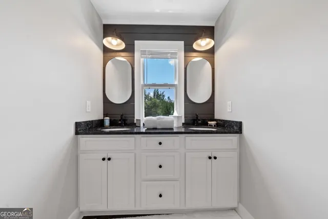 a view of a chairs and table on the wooden roof deck
