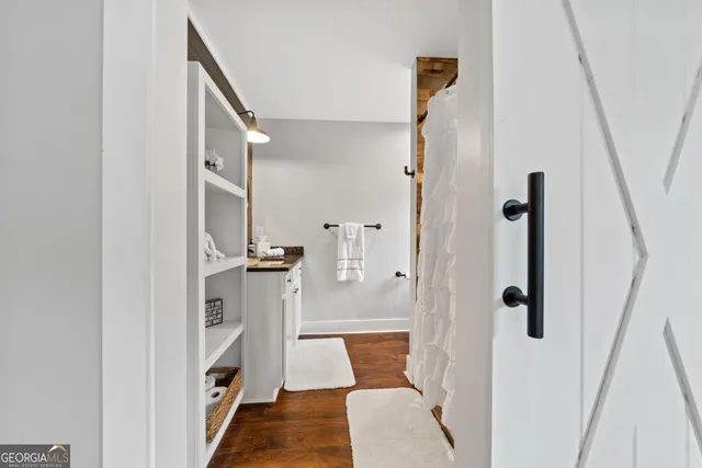 a view of a balcony with wooden floor